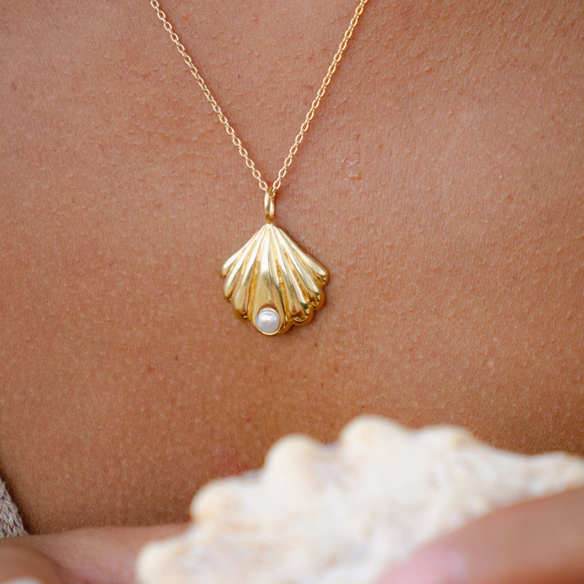 Gold shell pendant necklace with little 6mm size freshwater pearl. Elegant island style jewelry. Made by local artisans in Bali.