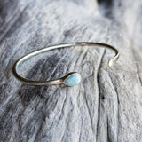 Handmade silver cuff with larimar drop